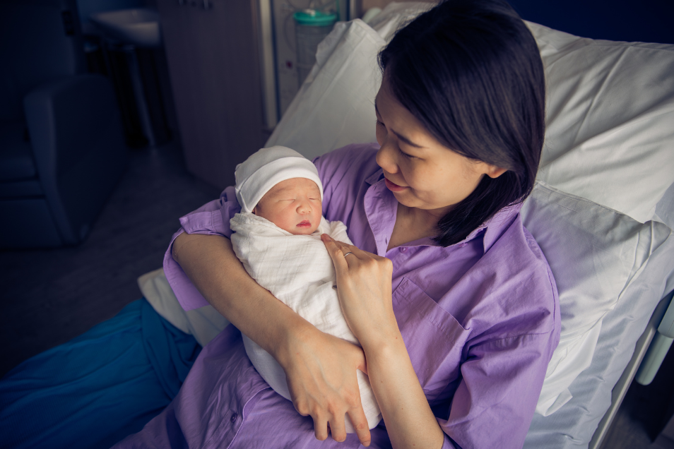 Mother Purple Shirt Holds Baby